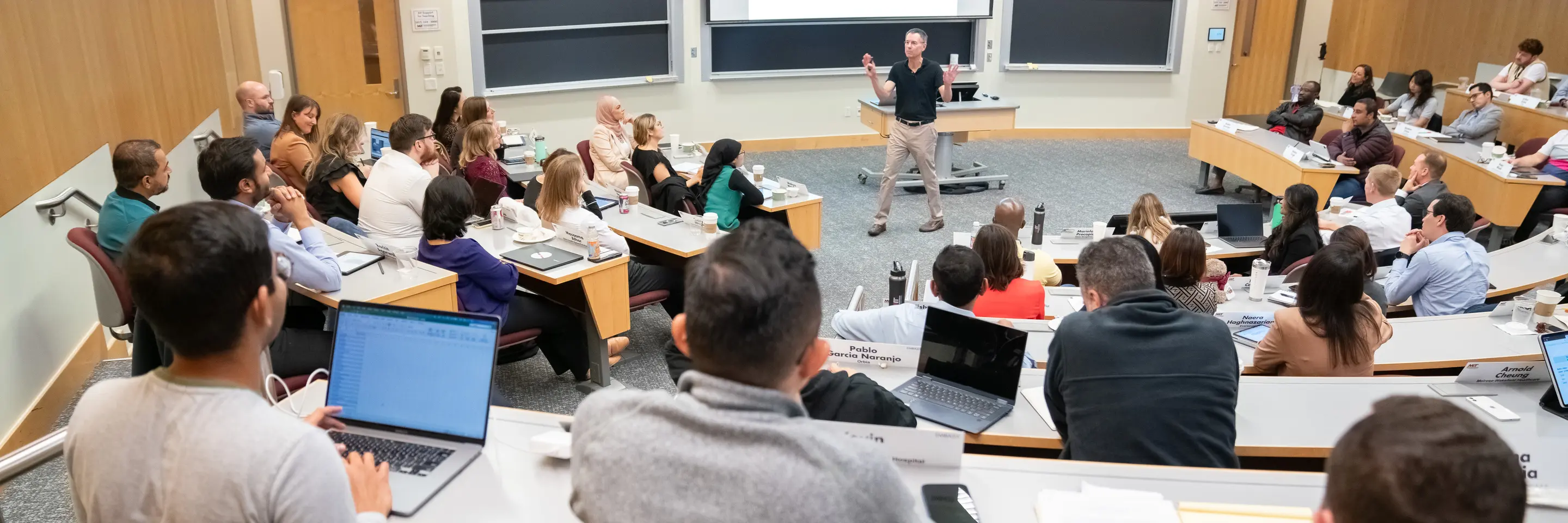 Professor Robert Gibbons teaching a full classroom