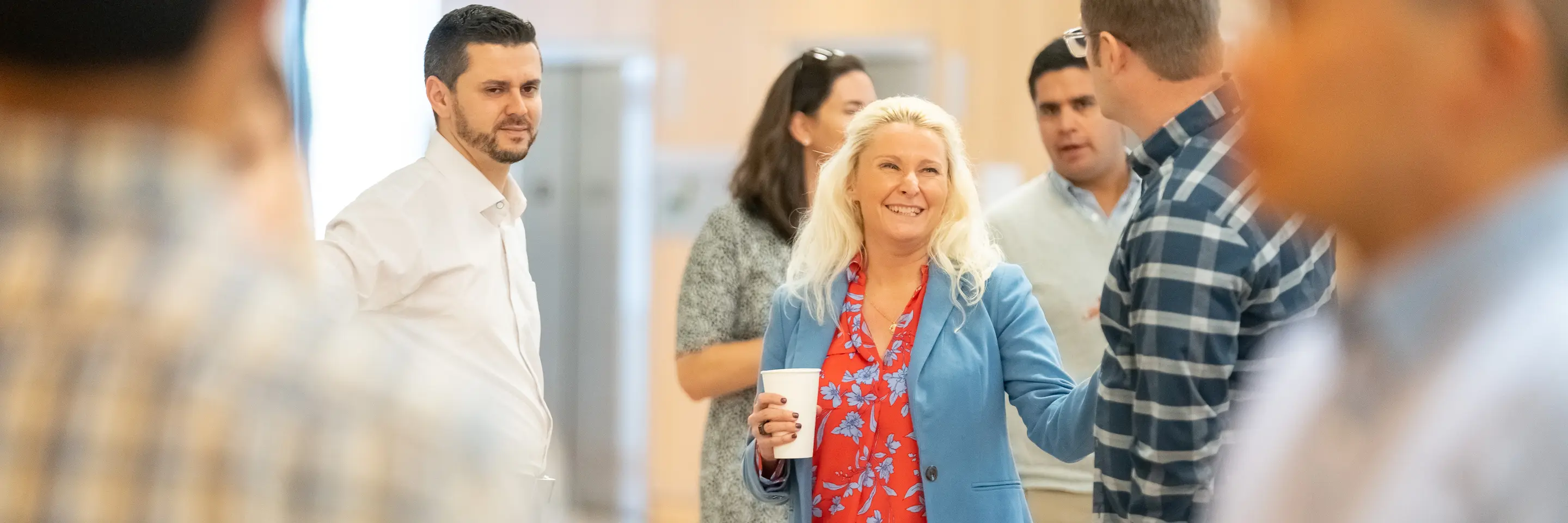 EMBA students talking during break