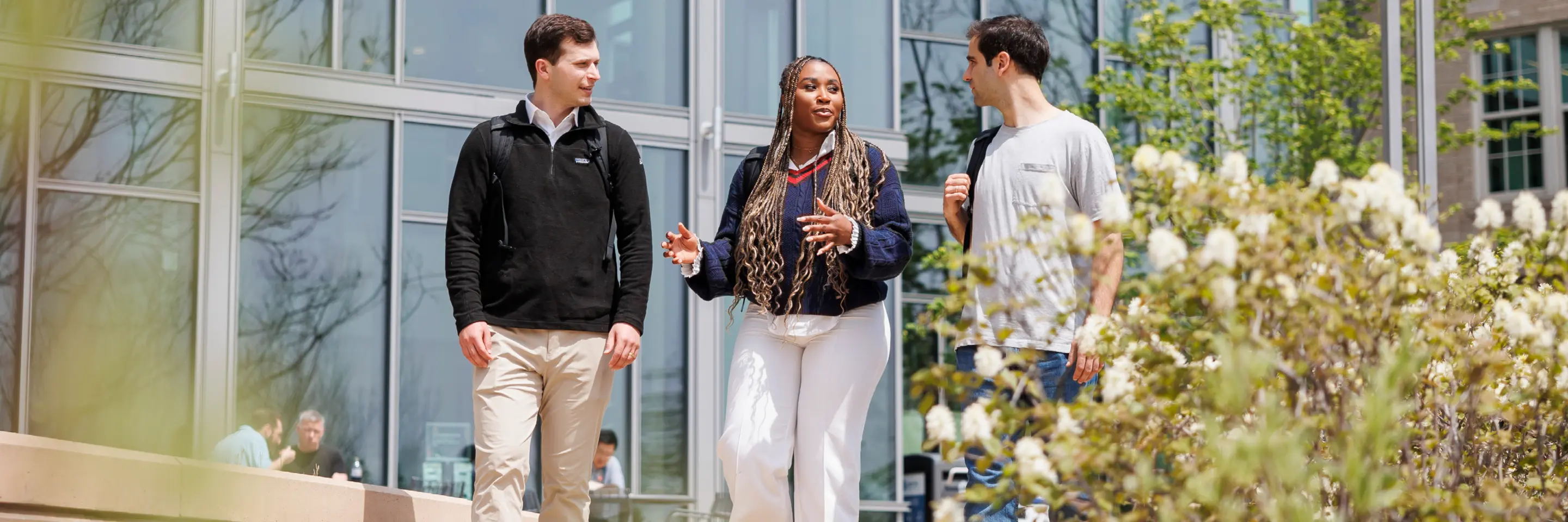 Students walk outside on MIT Sloan campus