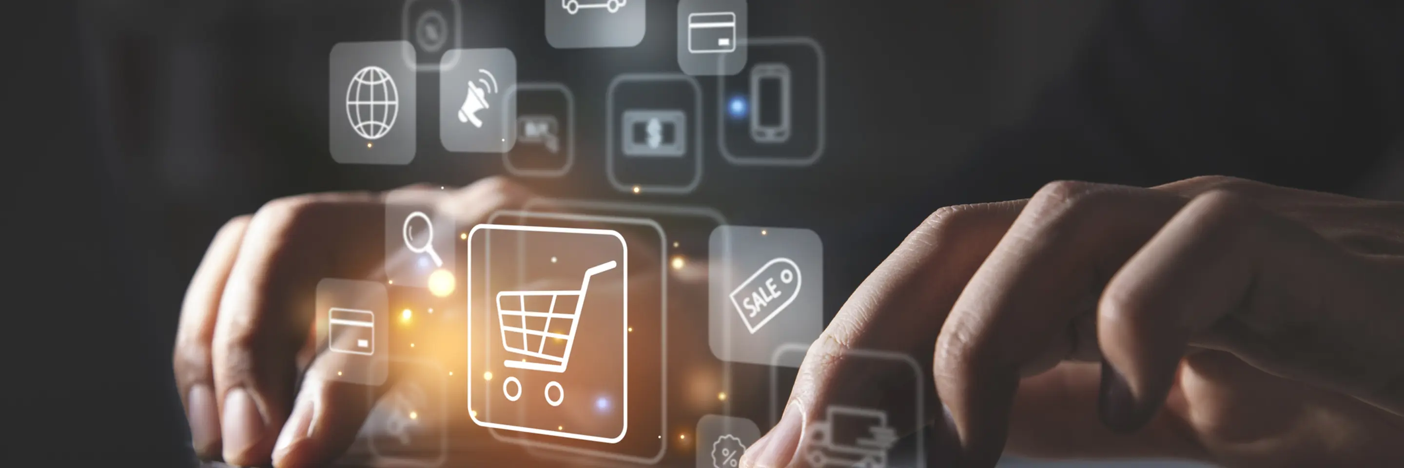 Young man using laptop with shopping cart icon