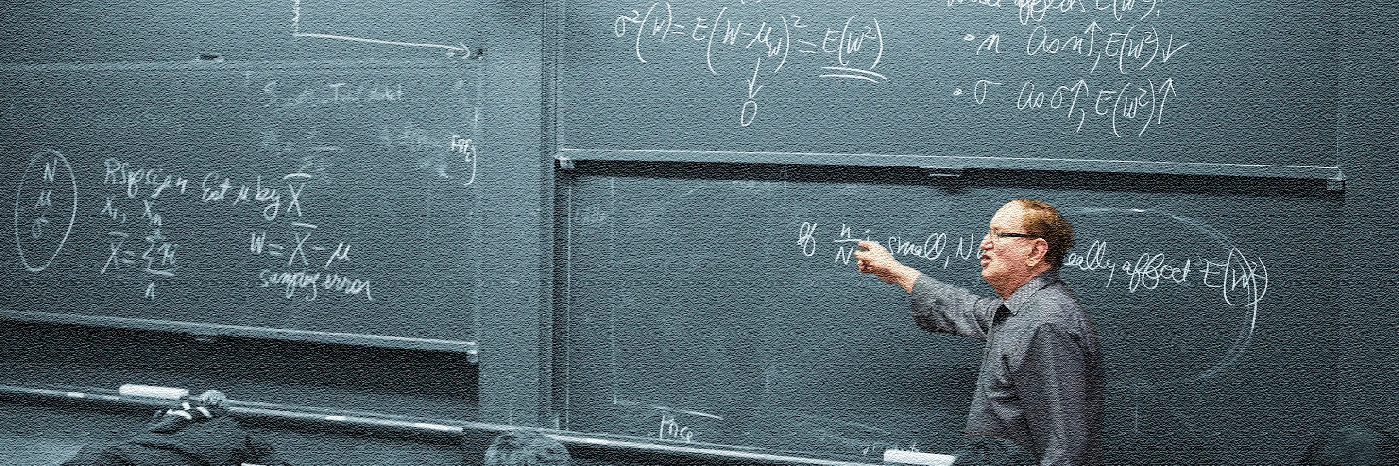 Arnold Barnett teaching at a chalkboard.