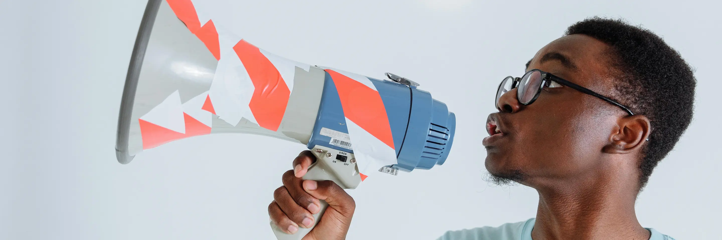 Image of a young man with a megaphone