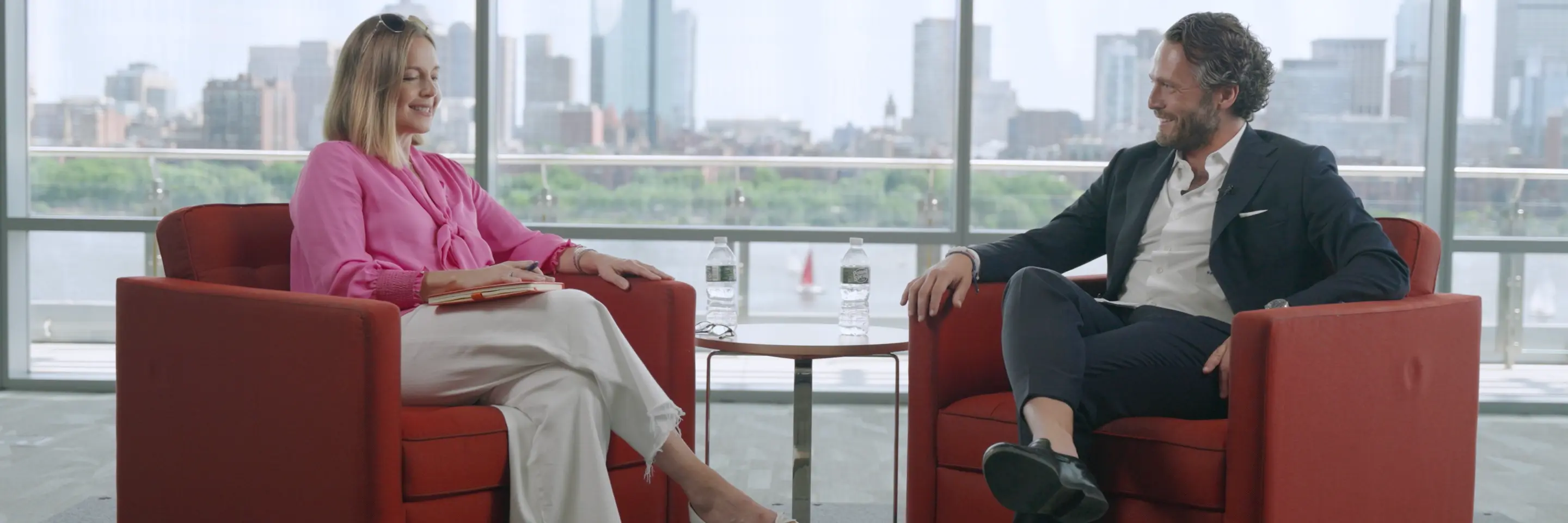 Fiona Murray and Raafat Azzouz sit facing each other and chatting