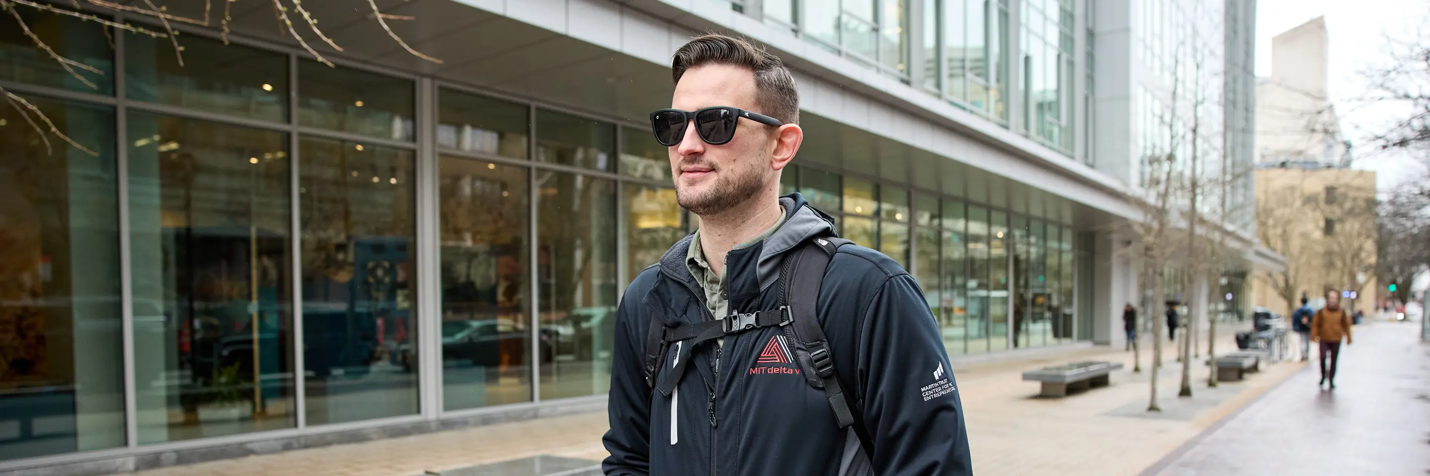 David Brown walks across MIT Sloan's campus