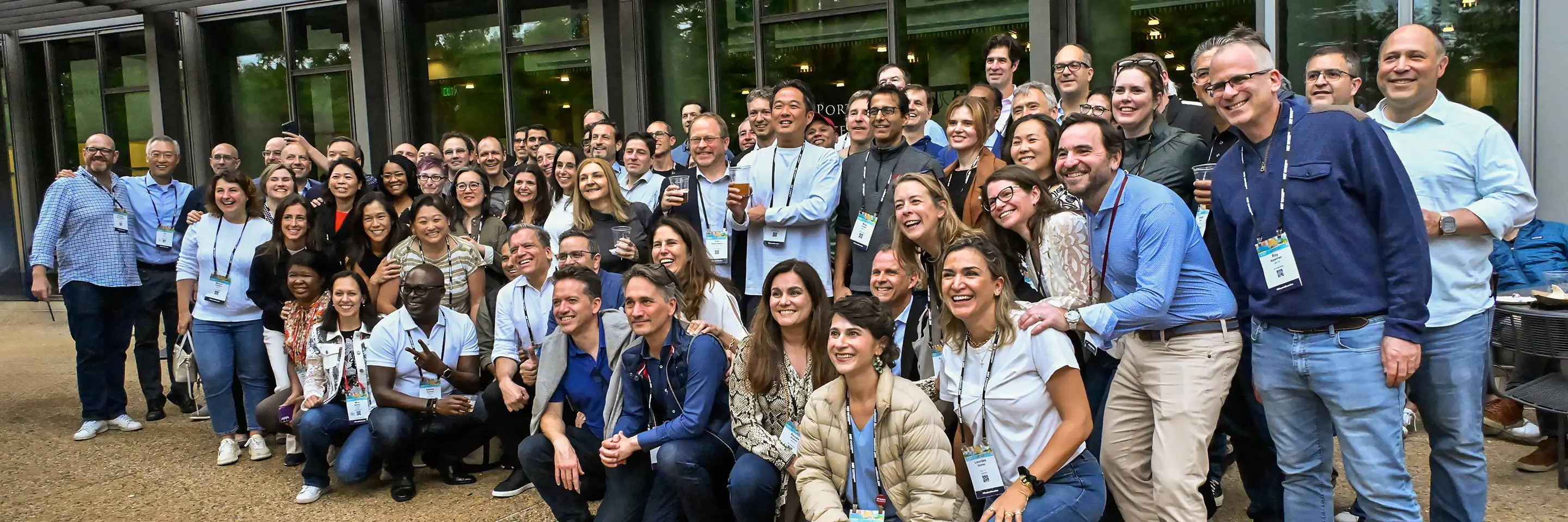 A large group of people poses for a photo off camera