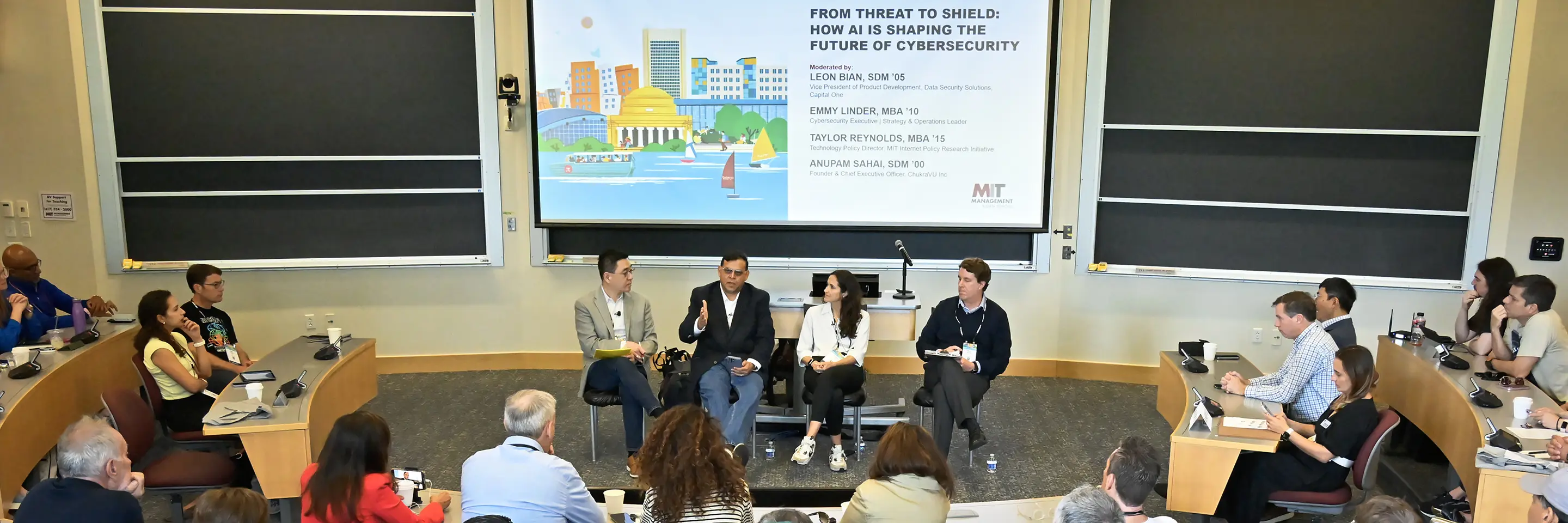 Panel speaks to audience in classroom