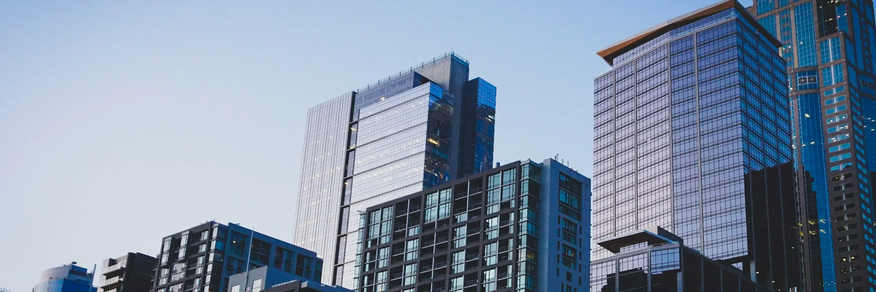 Photo of skycrapers against a clear blue sky