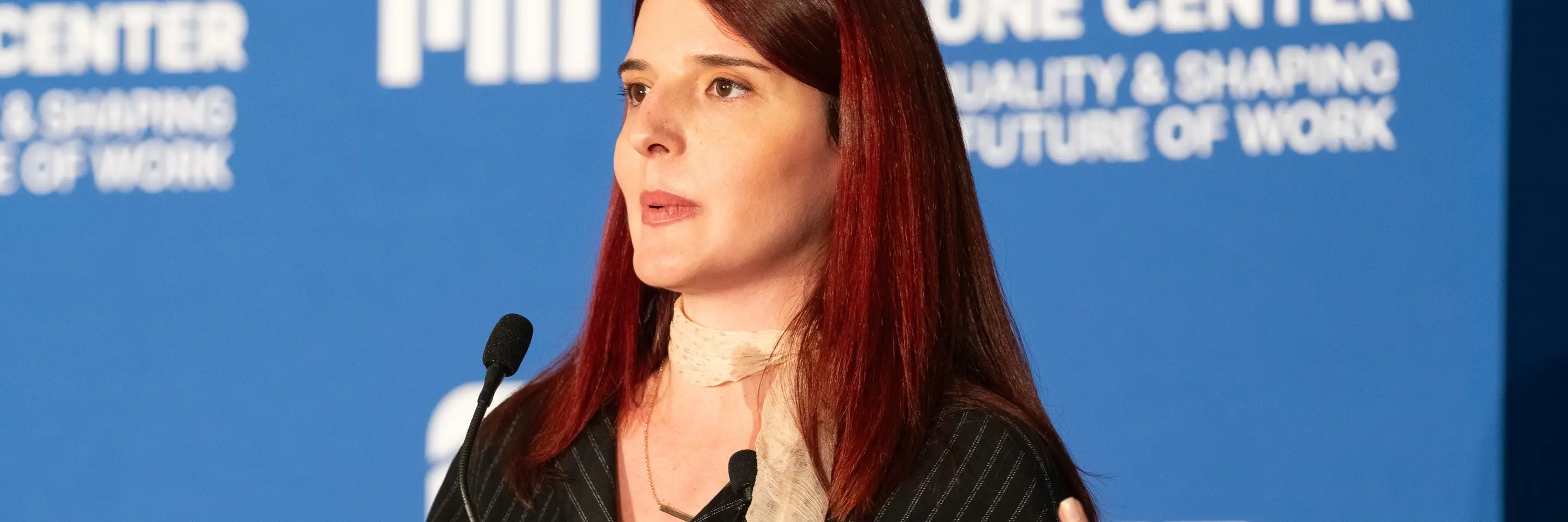 Scholar Zana Buçinca speaking at an MIT event