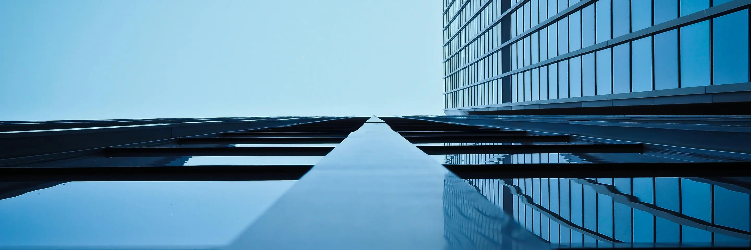 upwards view of blue buildings from the outside 