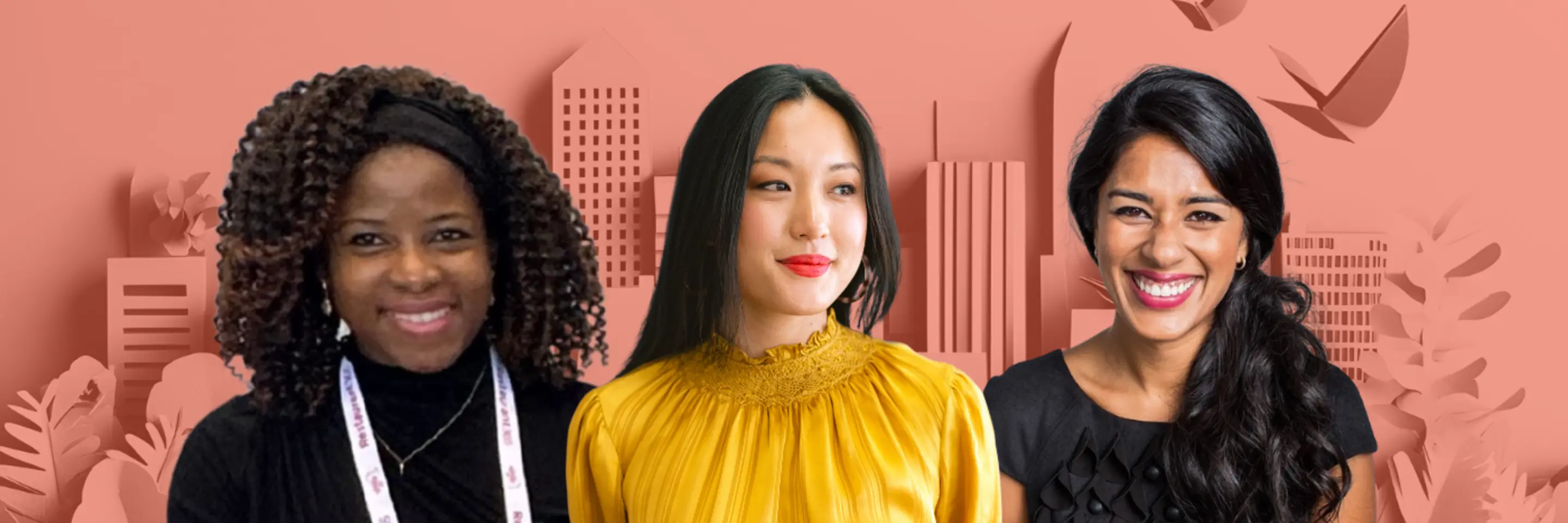 three women in front of city skyline