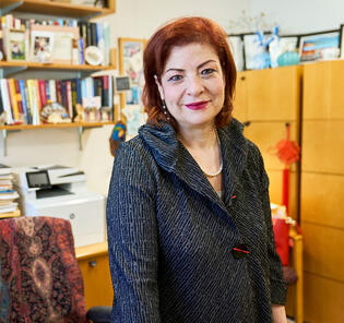 Georga Perakis headshot office