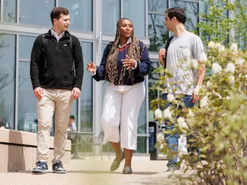 Students walk outside on MIT Sloan campus