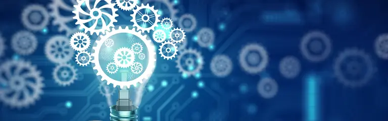 Hand holding a floating lightbulb against a dark blue background with glowing gears overlaid on the lightbulb