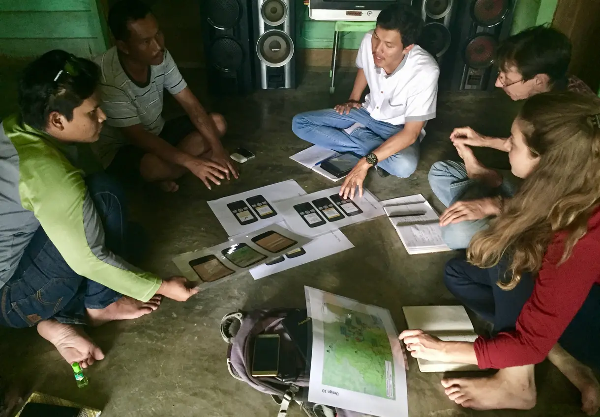 Illustrating and discussing market design ideas with market participants in rural Indonesia.
