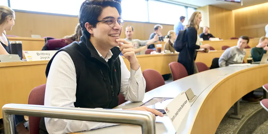 Sandro smiling as he gets ready for class