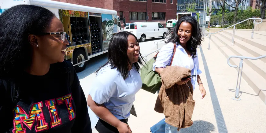 Lili walking over to E-62 with the outgoing Africa Business Club co-presidents, Khadija and Ebere