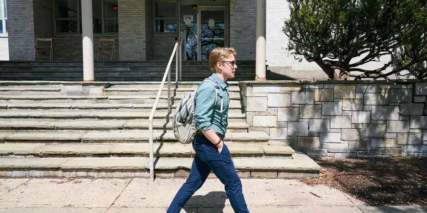 Thomas Wright walking to his MIT Sloan Senate meeting