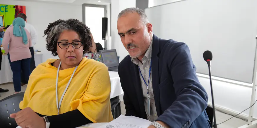Kirra Jarrat and Co-founder and CEO of Hay-green looking over papers