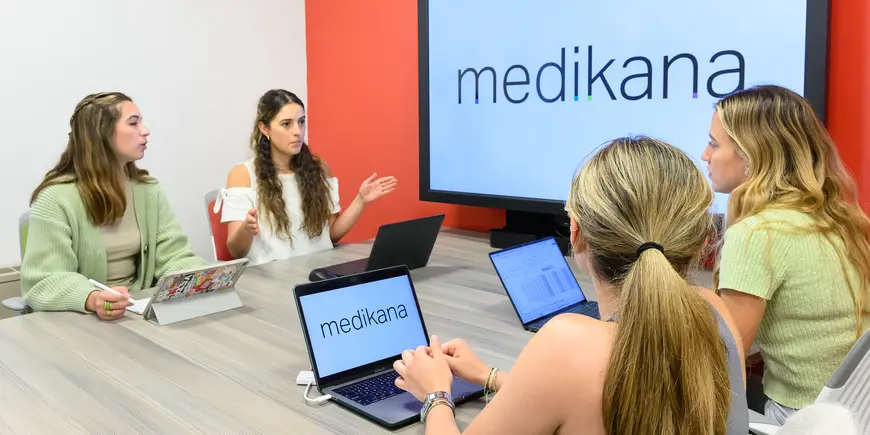 Students discuss an upcoming presentation