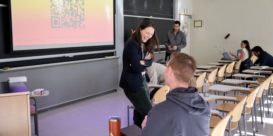 Jocelyn, a students, laughs and talks with her classmate.
