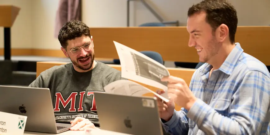 Jack O'Brien and his friend talk in class.