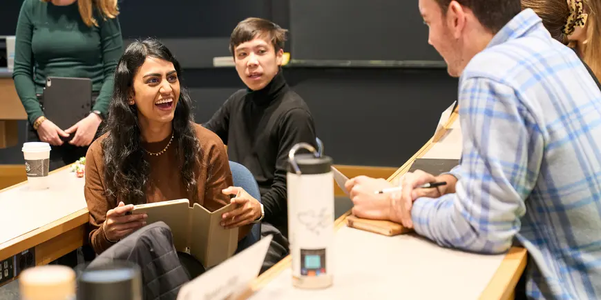 Jack O'Brien chats with one of his classmates in class.