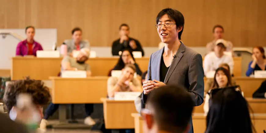 Professor Jackson Lu in front of his class.