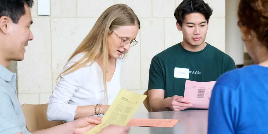 Anne Buisson meets with her team.