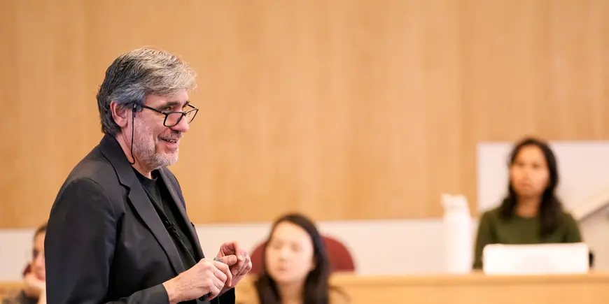 Professor Drazen Prelec teaches in front of the classroom.