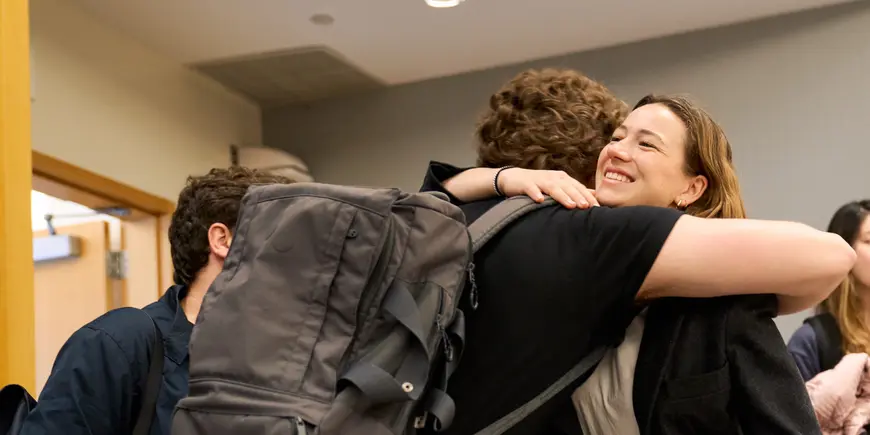 Benedetta Magni hugs her friend before class.