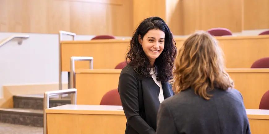 Benedetta Magni talks with her friend before class.