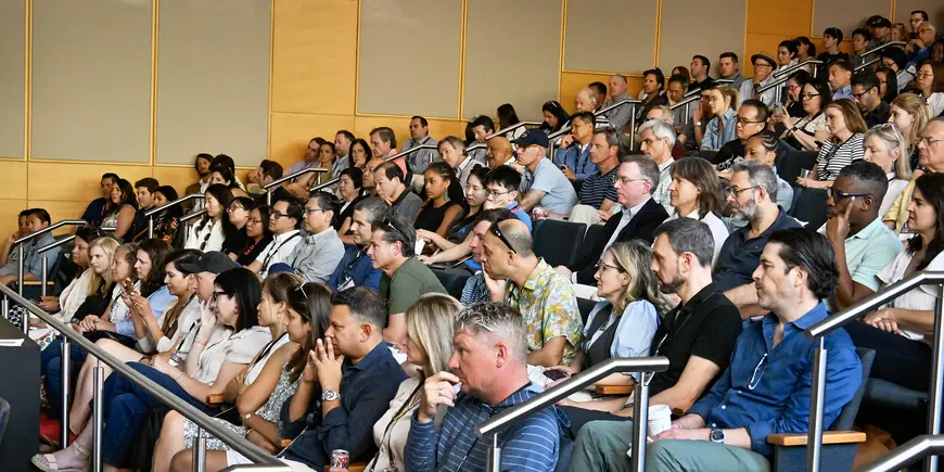 The audience in Wong Auditorium for the Dean's Fireside Chat at MIT Sloan Reunion 2024.