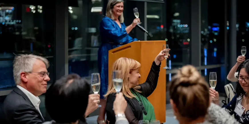 MIT Sloan community members raise a toast