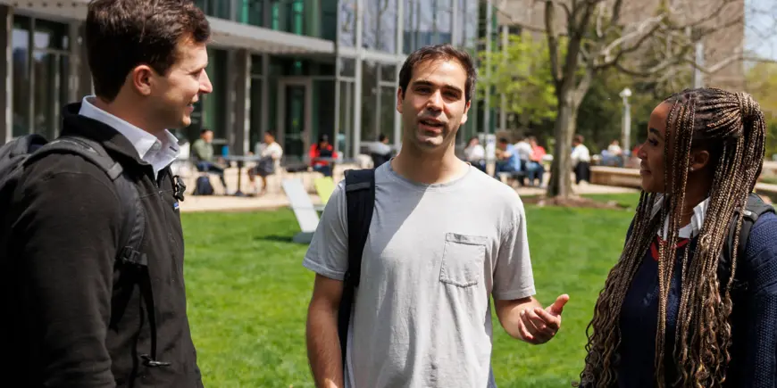 ID Lab students walk outside on campus