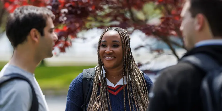ID Lab students talk outside on campus