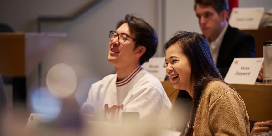 MBA student Sharon Fan smiles while sitting in class.