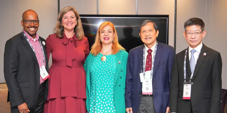 A group of people pose for a photo