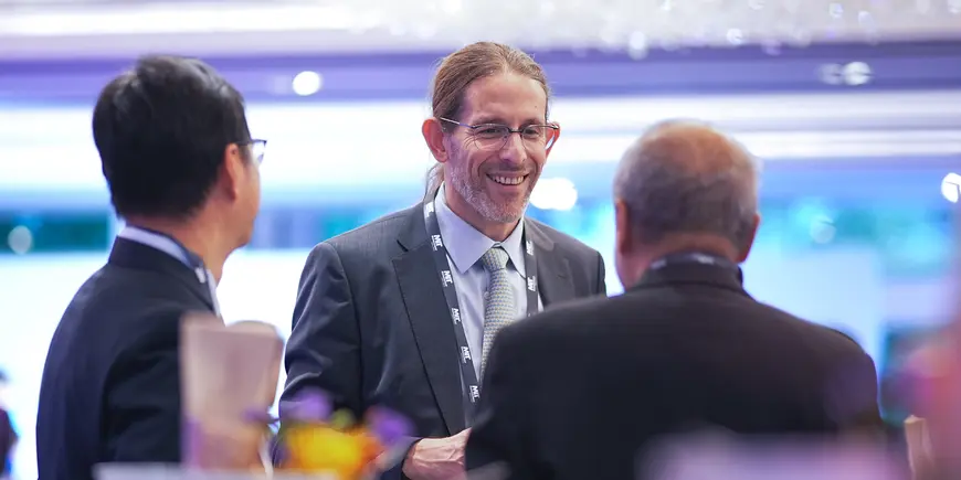 Three people in conversation