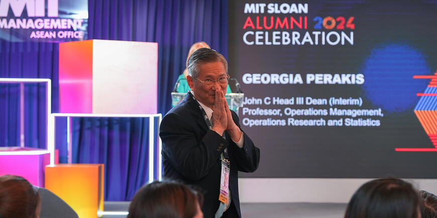 A man stands before a cheering audience