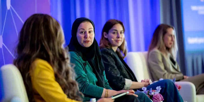 Panel of women speaking at event