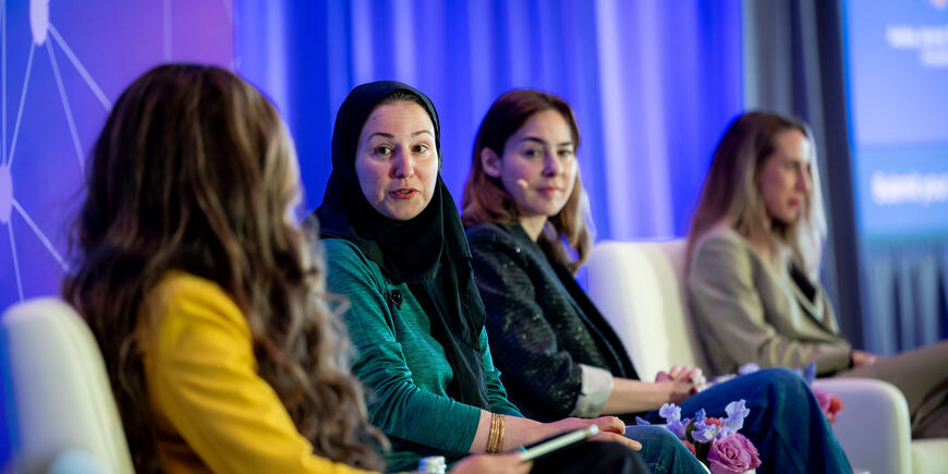 Panel of women speaking at event