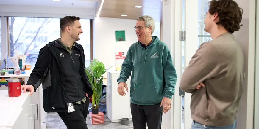 David Brown chats with two people at the Martin Trust Center