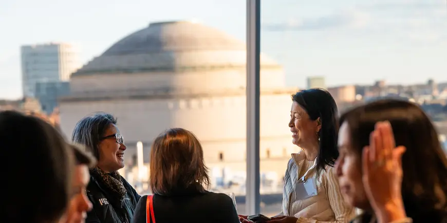 Group of women speak in front of MIT's Great Dome