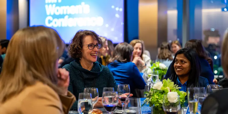 Group of women smiling and talking