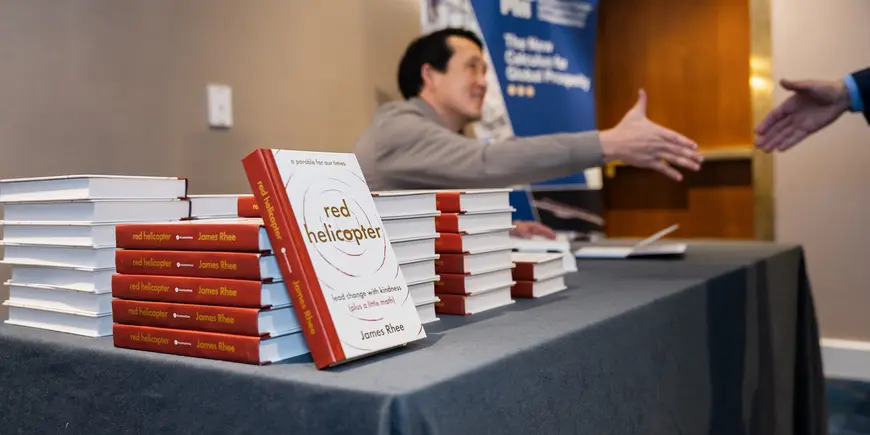 Photo of a man about to shake another mans hand