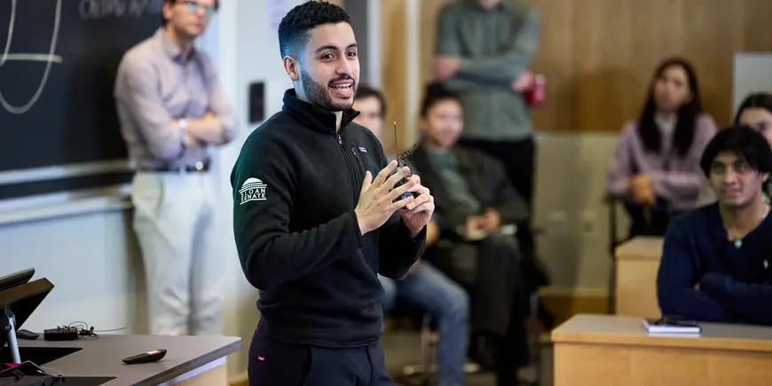 Mike Sanchez speaks to a room of prospective MBA students