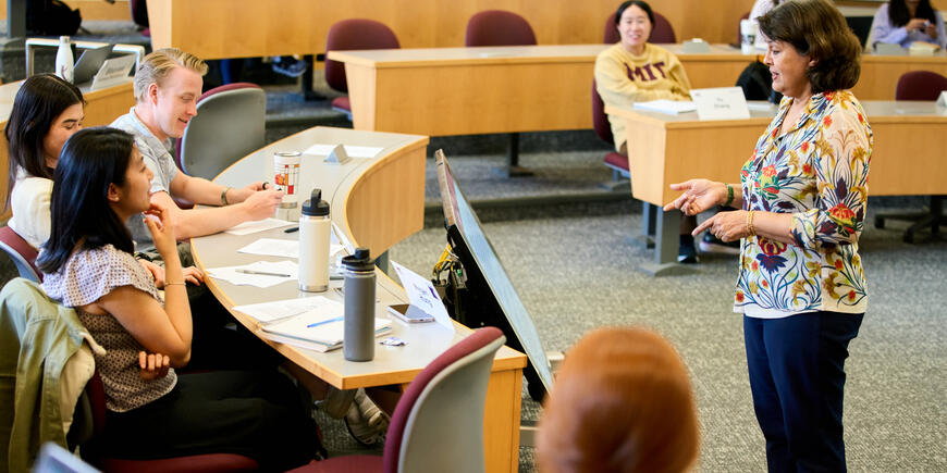 Rita Gao lectures to a hall of MIT Sloan students