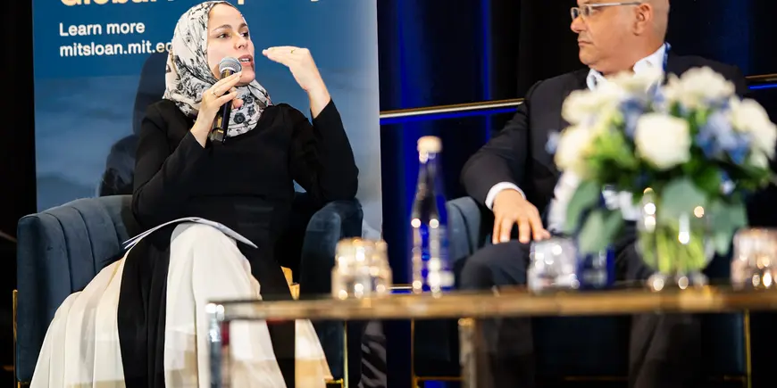 Photo of woman presenting at a panel