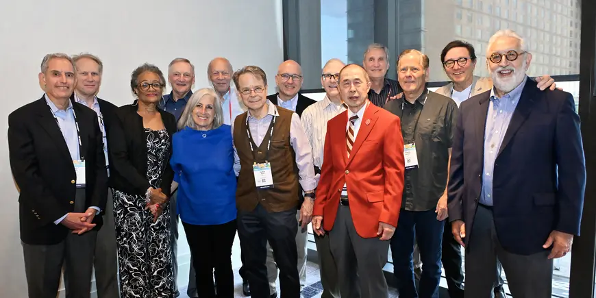 A group of people pose for a photo