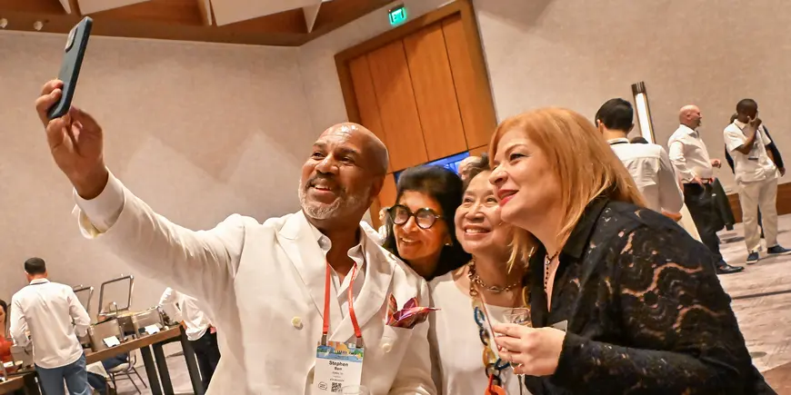 A small group poses for a selfie